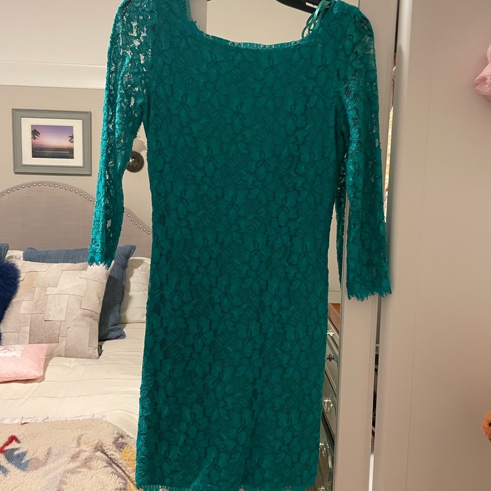 Worn three times. Doesn’t  fit anymore. Beautiful emerald green lace DVF dress